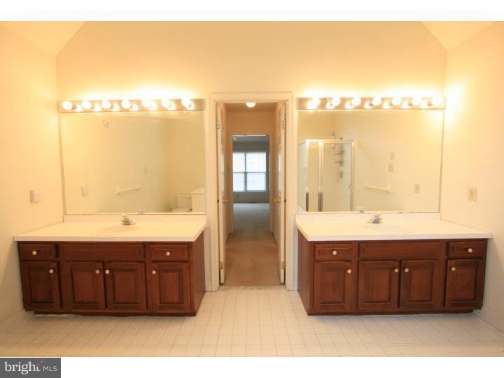630 East Hillendale Road Chadds Ford, PA 19317 - Photo 14 of 18 a bathroom with a sink and a mirror