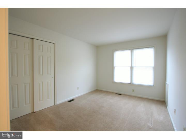 630 East Hillendale Road Chadds Ford, PA 19317 - Photo 16 of 18 an empty room with wooden floor and windows