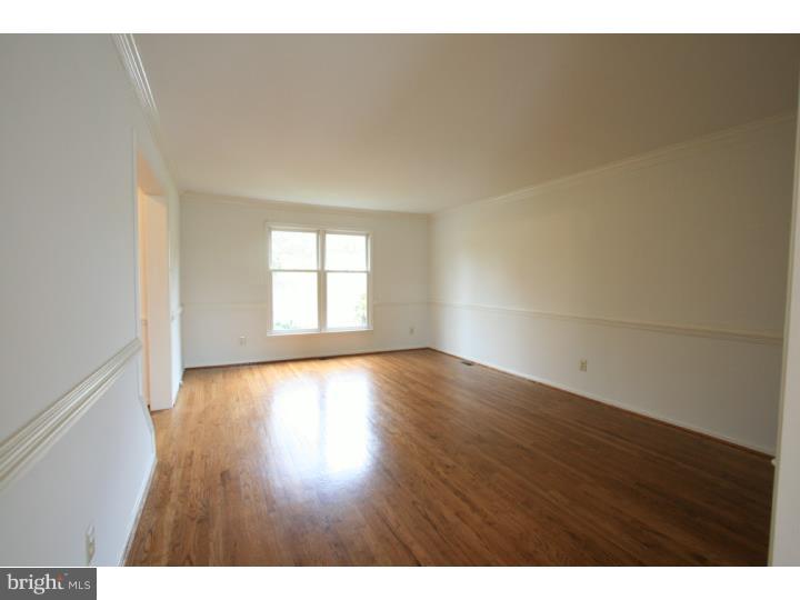 630 East Hillendale Road Chadds Ford, PA 19317 - Photo 4 of 18 a view of an empty room with wooden floor and a window