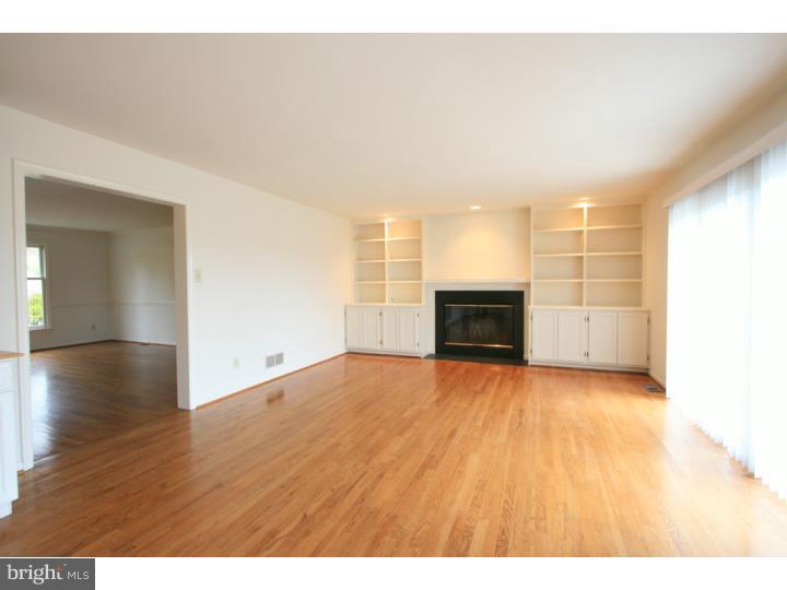 630 East Hillendale Road Chadds Ford, PA 19317 - Photo 7 of 18 a view of empty room with wooden floor and fireplace