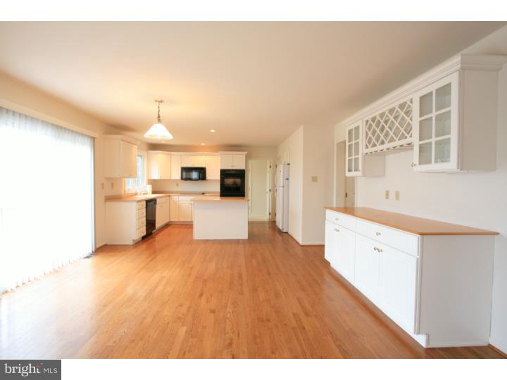 630 East Hillendale Road Chadds Ford, PA 19317 - Photo 8 of 18 a large white kitchen with sink and wooden floor
