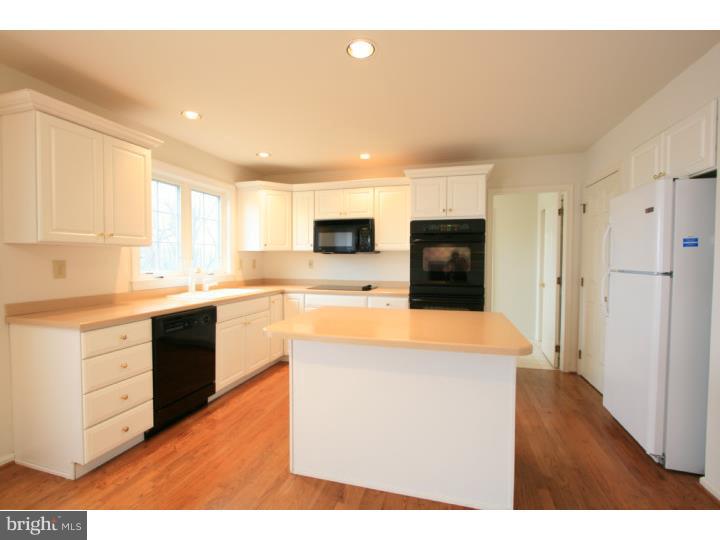 630 East Hillendale Road Chadds Ford, PA 19317 - Photo 9 of 18 a large kitchen with stainless steel appliances kitchen island granite countertop a refrigerator a stove top oven a sink and dishwasher