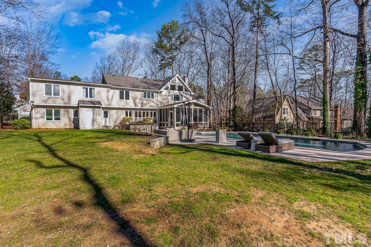 113 Bruce Drive Cary, NC 27511 - Photo 14 of 48 a view of a house with swimming pool and sitting area