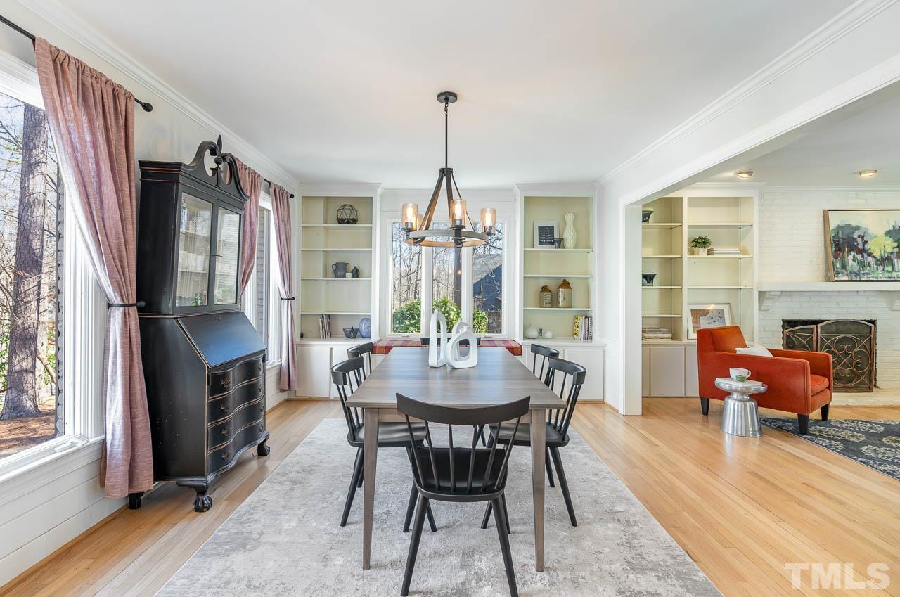 113 Bruce Drive Cary, NC 27511 - Photo 17 of 48 a dining room with furniture a chandelier and wooden floor