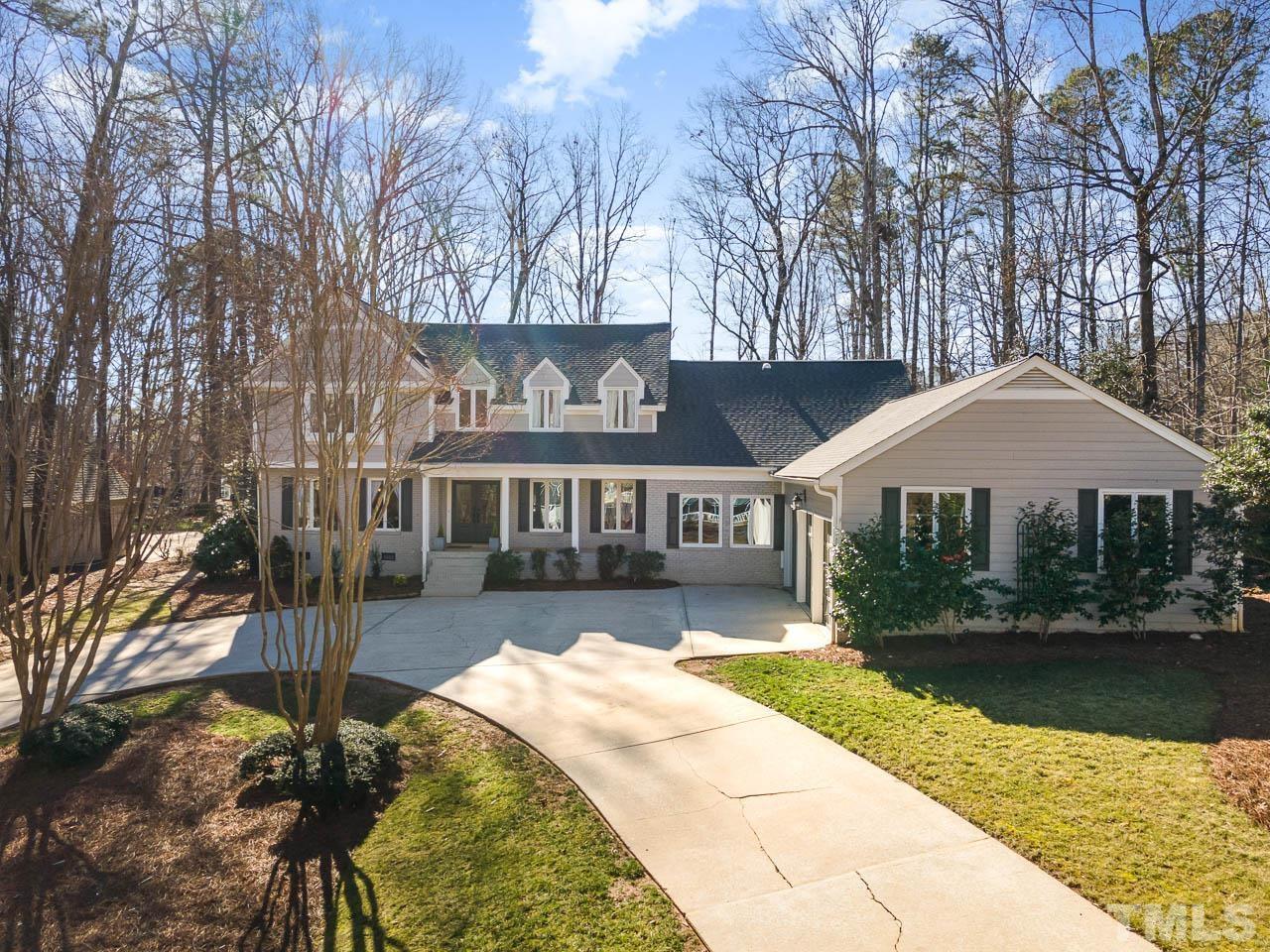 113 Bruce Drive Cary, NC 27511 - Photo 2 of 48 a front view of a house with a yard