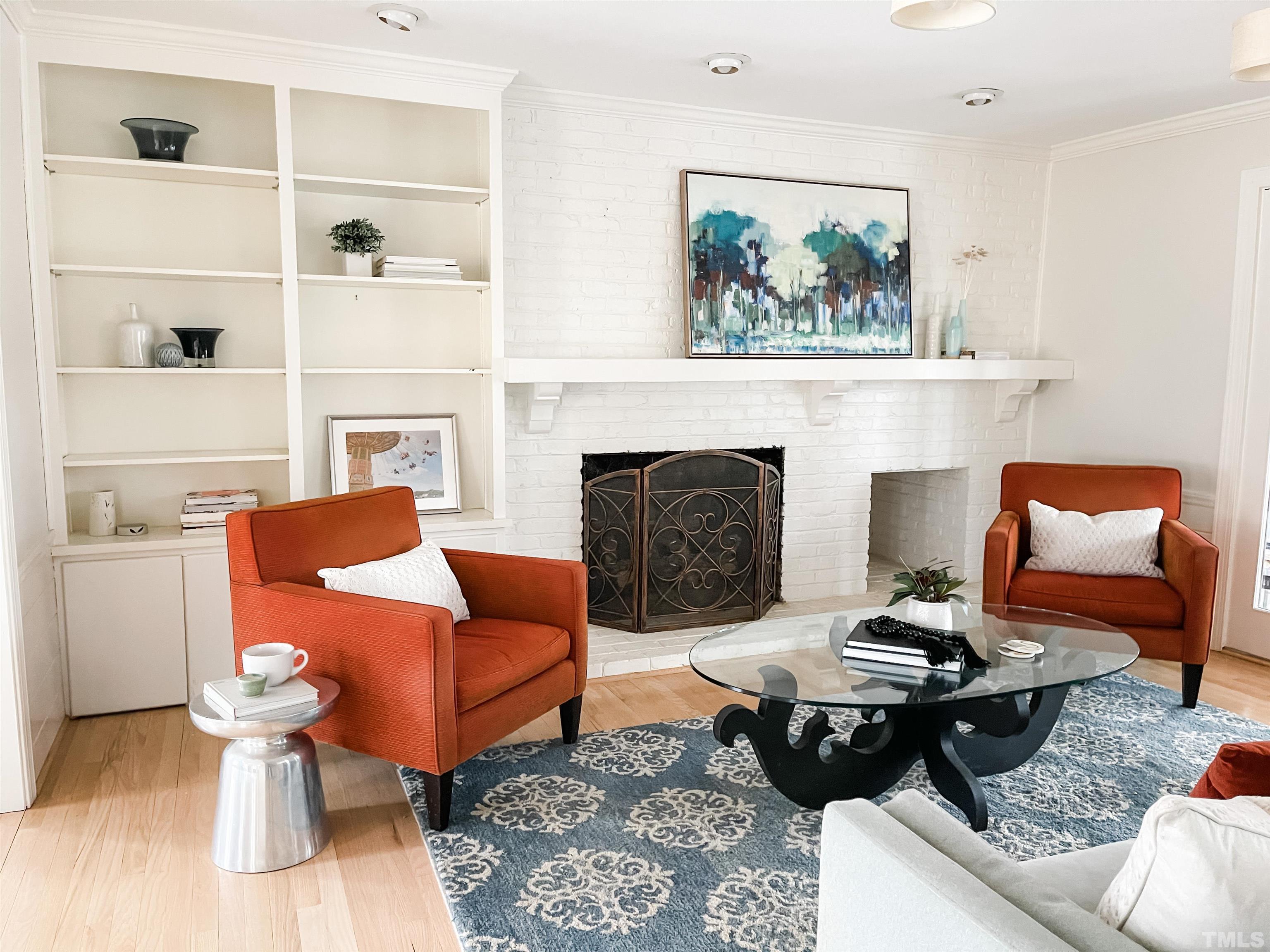 113 Bruce Drive Cary, NC 27511 - Photo 22 of 48 a living room with furniture and a fireplace