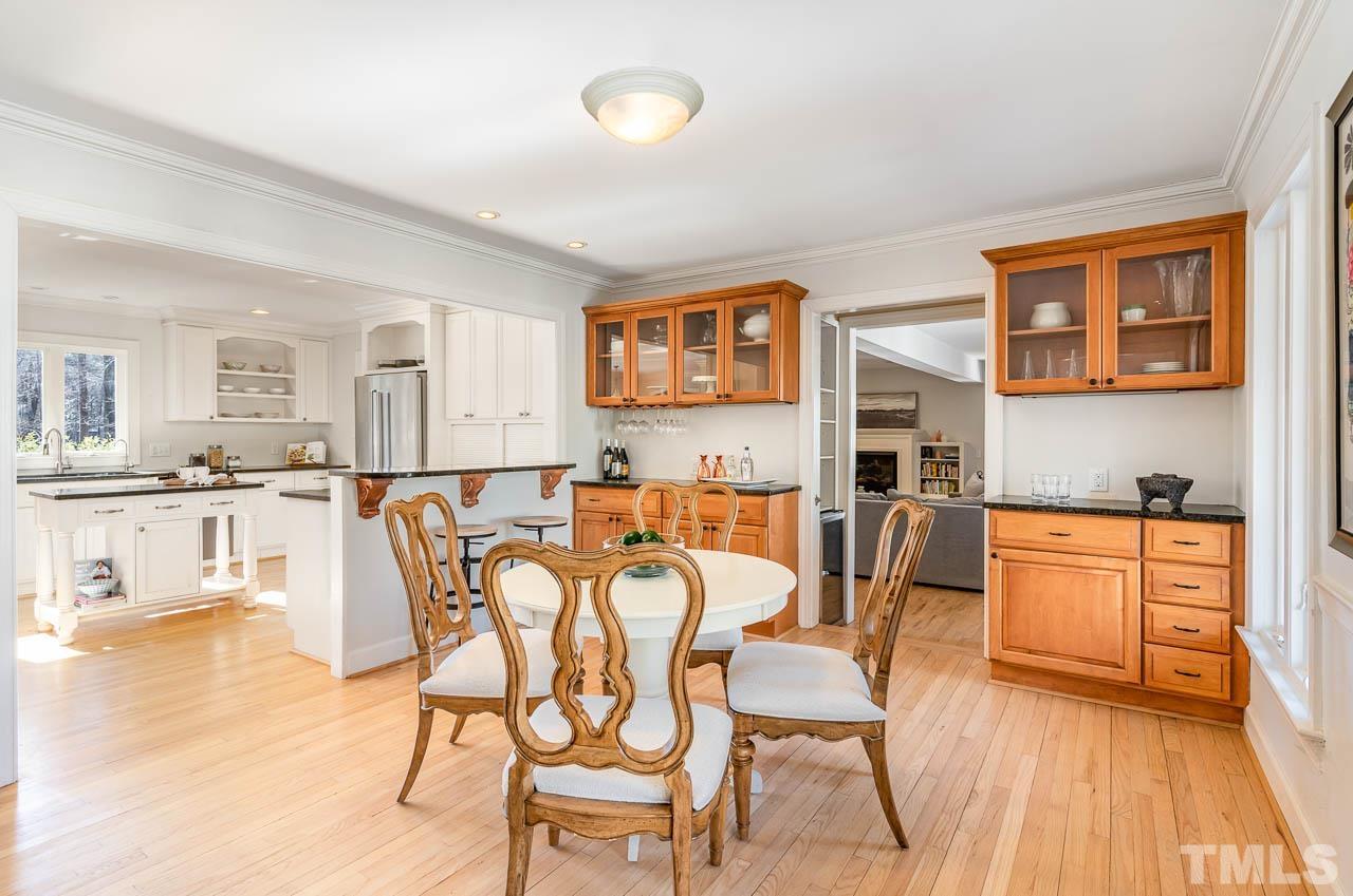 113 Bruce Drive Cary, NC 27511 - Photo 23 of 48 a view of a dining room with furniture and wooden floor