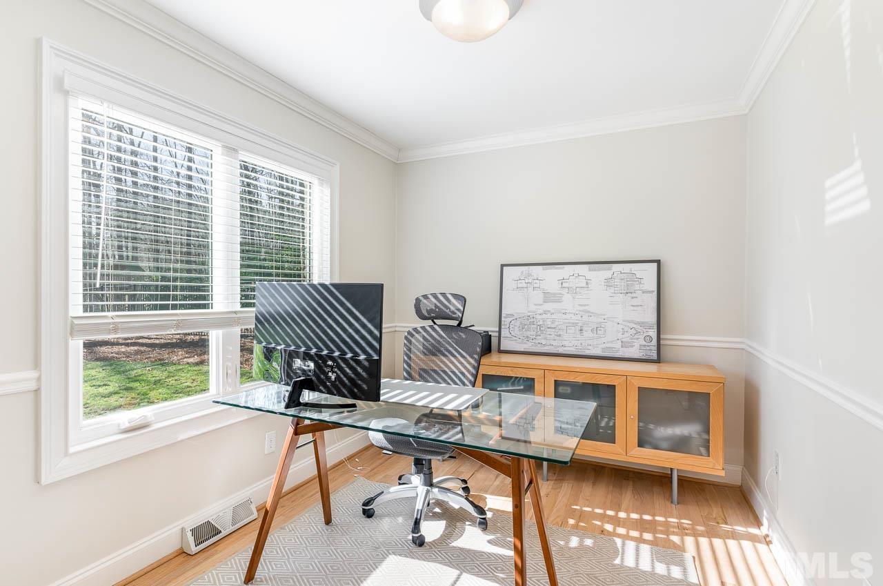 113 Bruce Drive Cary, NC 27511 - Photo 27 of 48 a view of a workspace with furniture and a window