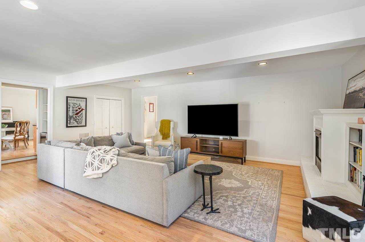 113 Bruce Drive Cary, NC 27511 - Photo 30 of 48 a living room with furniture and a flat screen tv