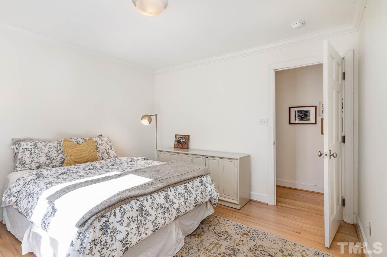 113 Bruce Drive Cary, NC 27511 - Photo 38 of 48 a bedroom with a bed and a window