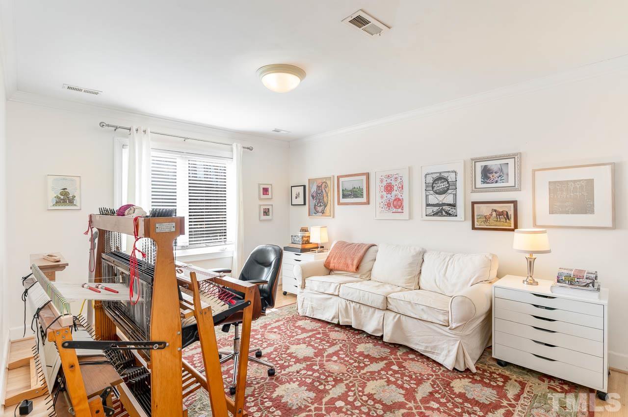 113 Bruce Drive Cary, NC 27511 - Photo 40 of 48 a living room with furniture and wooden floor