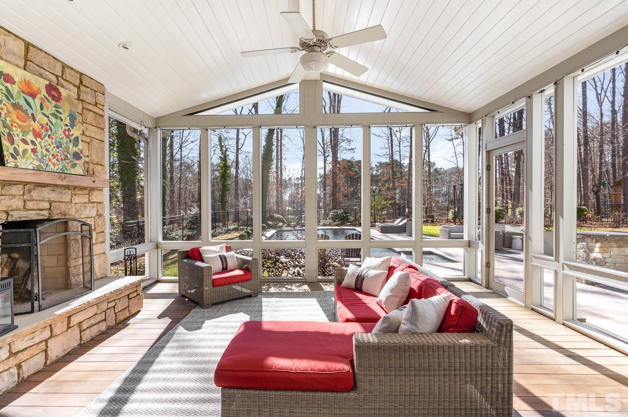 113 Bruce Drive Cary, NC 27511 - Photo 9 of 48 a living room with furniture and floor to ceiling windows