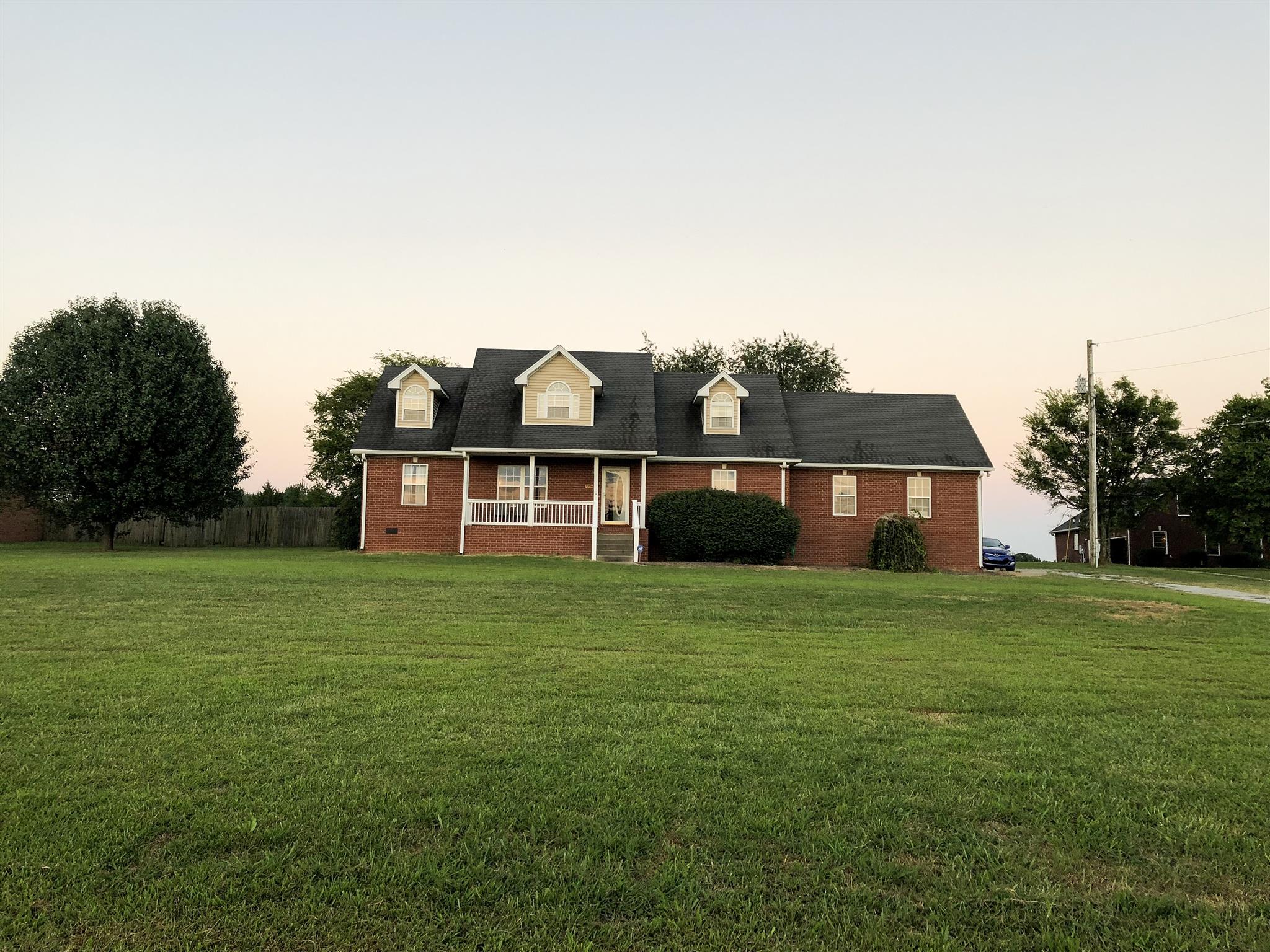 2918 Academy Road Portland, TN 37148 - Photo 21 of 26 a view of a big house with a big yard plants and large trees