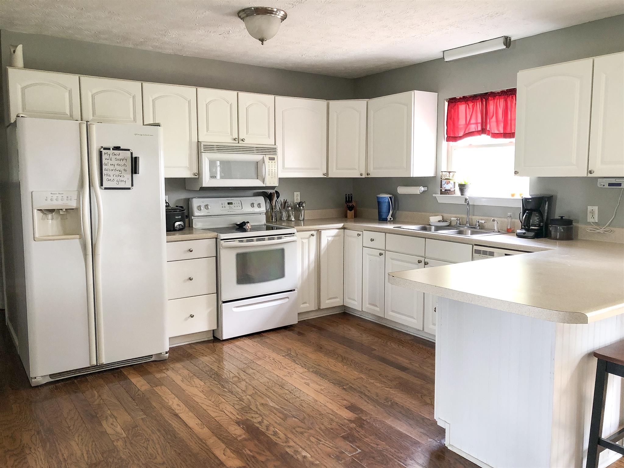 2918 Academy Road Portland, TN 37148 - Photo 3 of 26 a kitchen with stainless steel appliances granite countertop a stove a sink dishwasher and a refrigerator