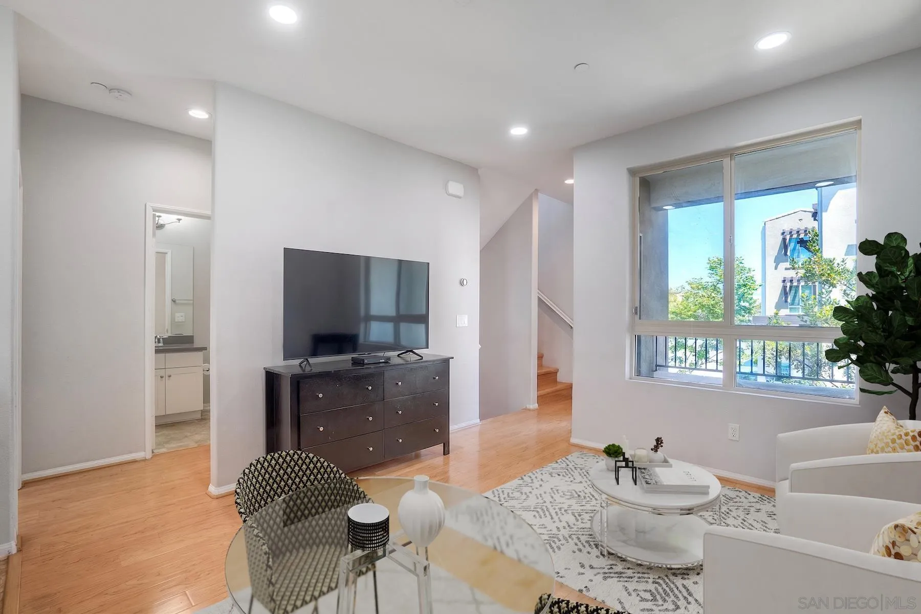 8850 Olive Lane, Unit 7 Santee, CA 92071 - Photo 5 of 27 a living room with furniture and a flat screen tv