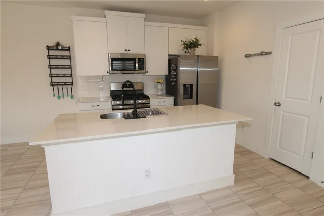 a kitchen with a stove and a microwave
