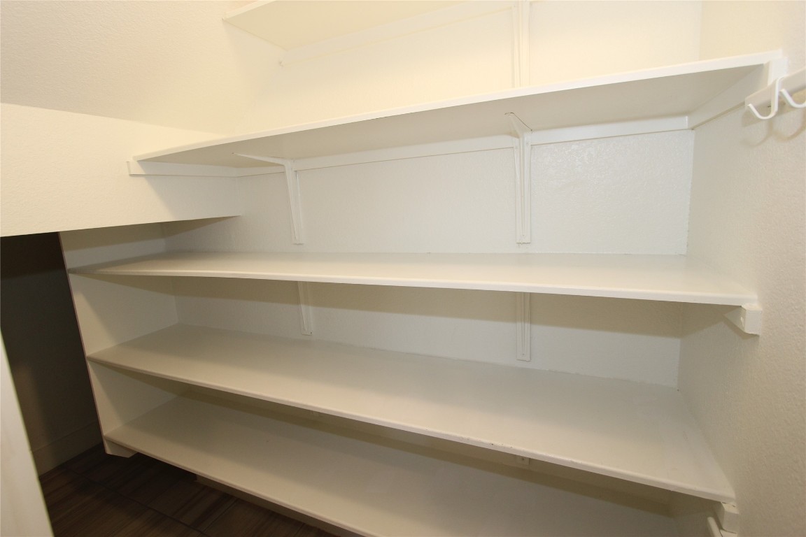131 Furlong Drive Georgetown, TX 78626 - Photo 14 of 36 Big pantry, lots of shelves and wrap around storage under stairs