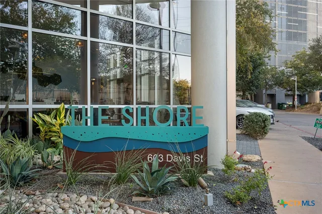 a view of a chair and table in backyard
