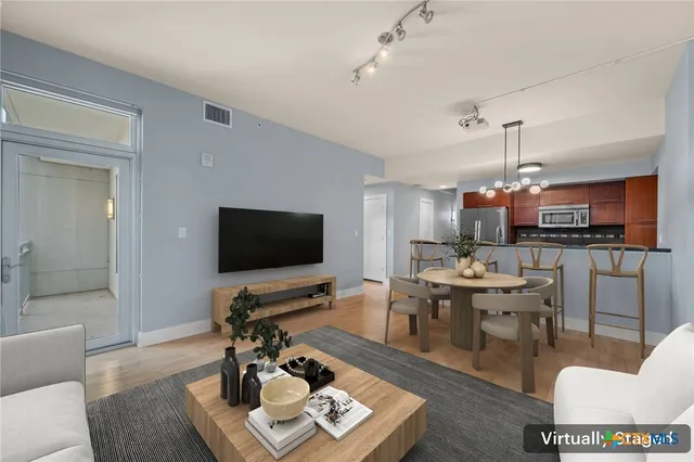 a view of a kitchen with furniture and windows