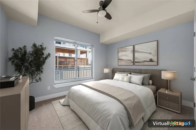 a view of an empty room with a ceiling fan