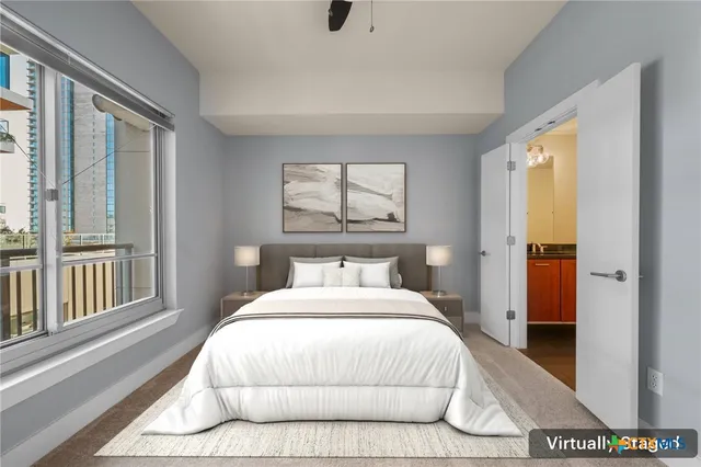 a bathroom with a granite countertop sink a toilet a mirror and shower
