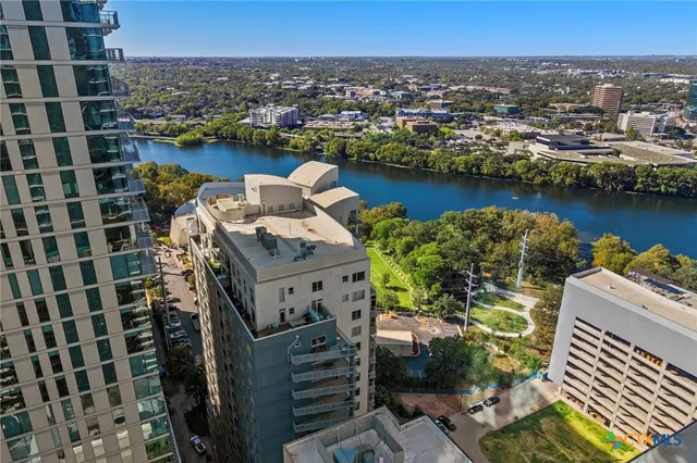 a view of a lake with building in front of it