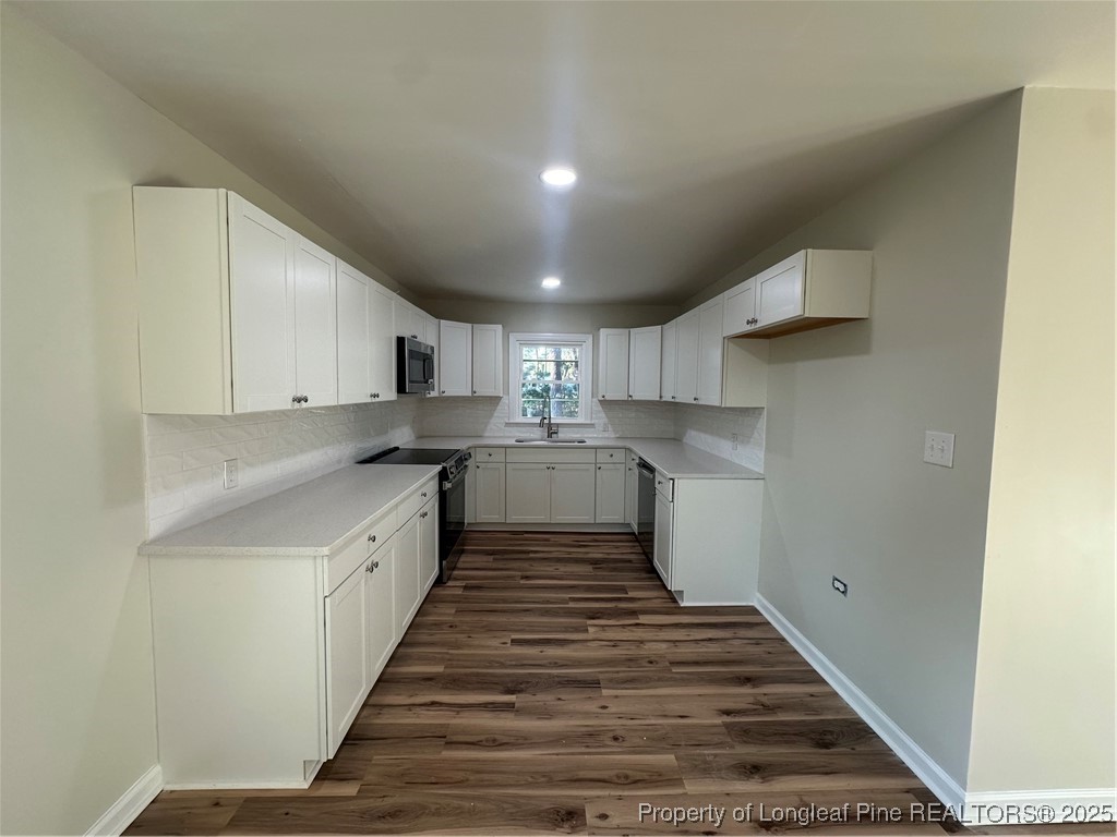 411 Lafayette Street Clinton, NC 28328 - Photo 14 of 24 a kitchen with sink and cabinets