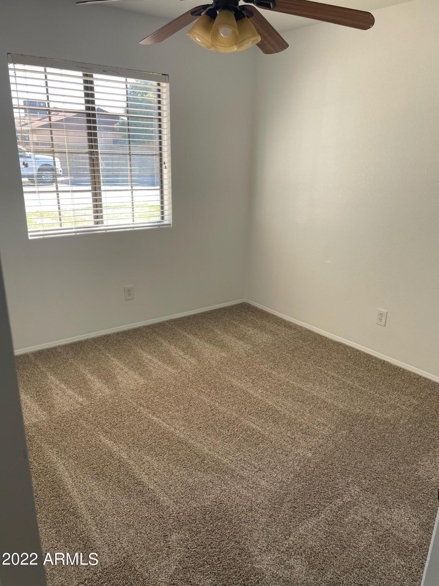 Undisclosed Address Mesa, AZ 85213 - Photo 8 of 10 an empty room with a window