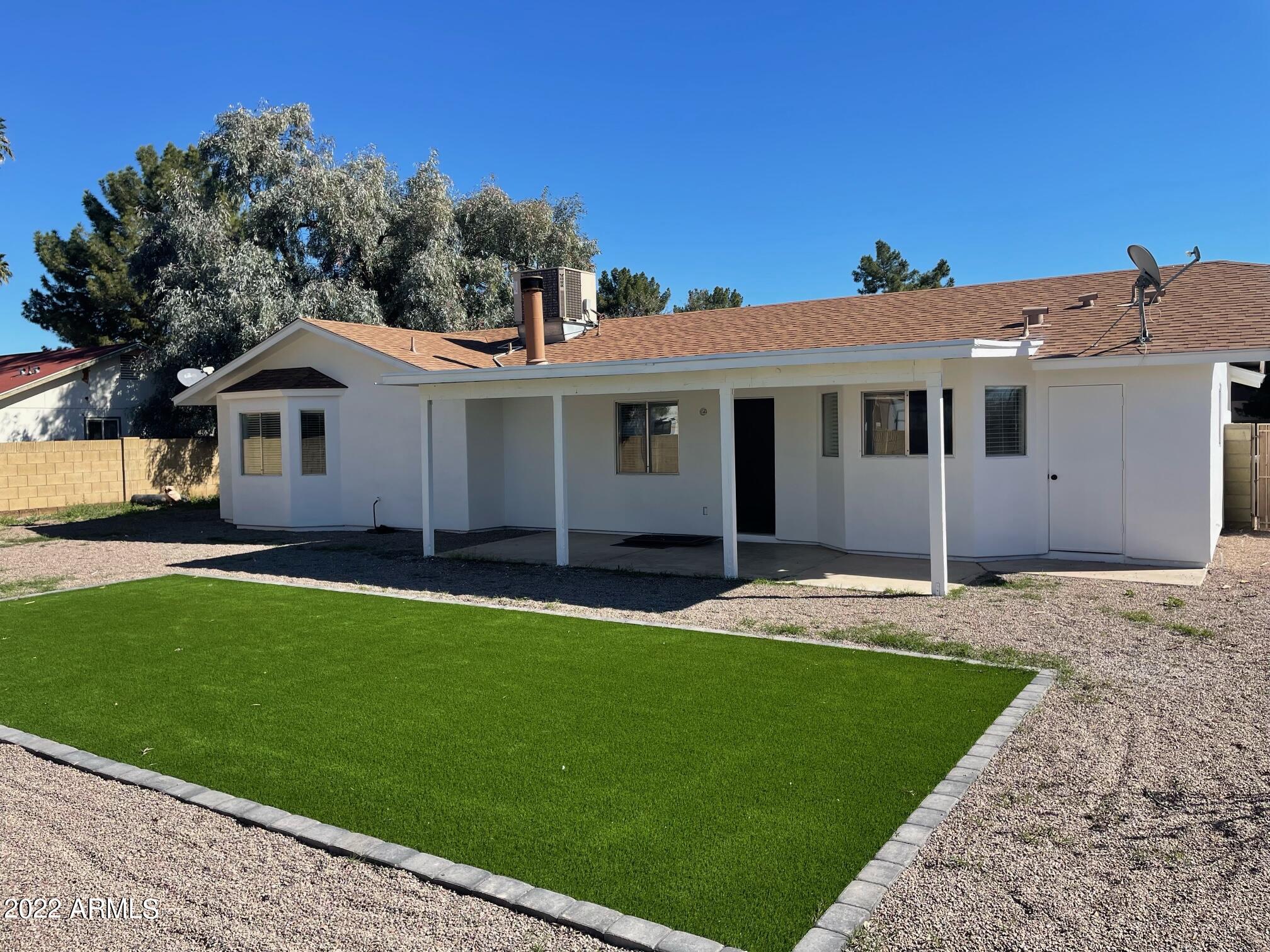 Undisclosed Address Mesa, AZ 85213 - Photo 10 of 10 a front view of a house with a yard and garage