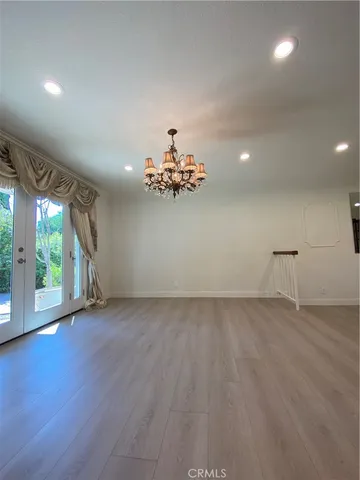 a view of livingroom and kitchen with hardwood floor and window