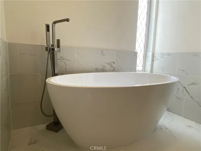a bathroom with a toilet sink and shower