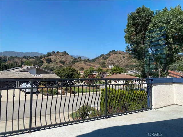 a view of a bench in front of house