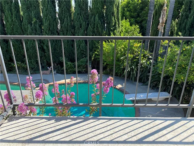 a view of a swimming pool with a yard