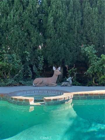 a outdoor space with patio the couches and chairs with potted plants