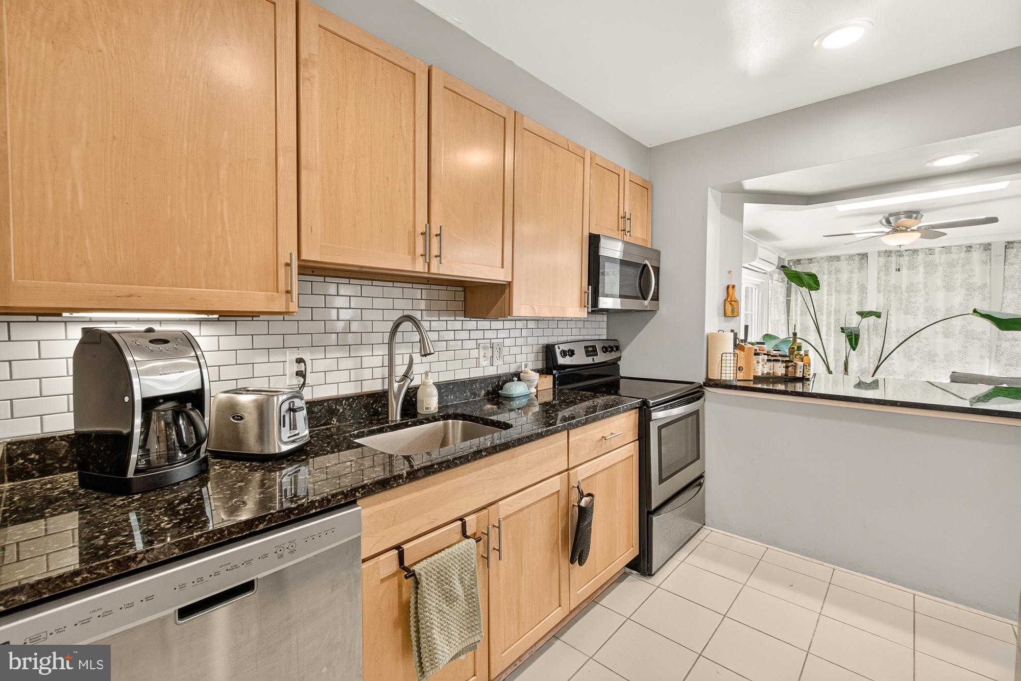 10202 Leslie Street Silver Spring, MD 20910 - Photo 16 of 44 Modern kitchen with sleek finishes.