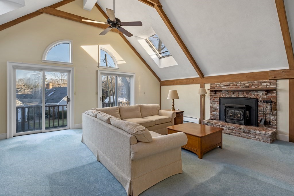 8 Edgemere Road Marblehead, MA 01945 - Photo 15 of 41 a living room with furniture and a fireplace