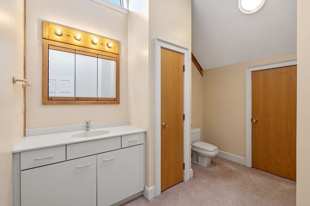8 Edgemere Road Marblehead, MA 01945 - Photo 27 of 41 a bathroom with a sink a toilet and a window