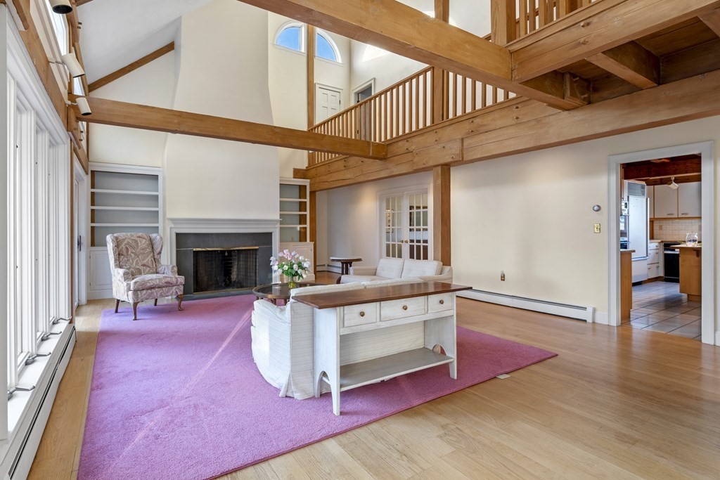 8 Edgemere Road Marblehead, MA 01945 - Photo 8 of 41 a living room with furniture a fireplace and a table