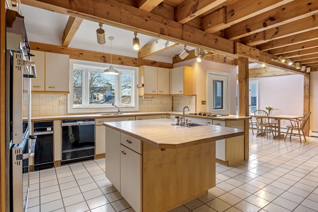 8 Edgemere Road Marblehead, MA 01945 - Photo 10 of 41 a kitchen with a sink and stove top oven