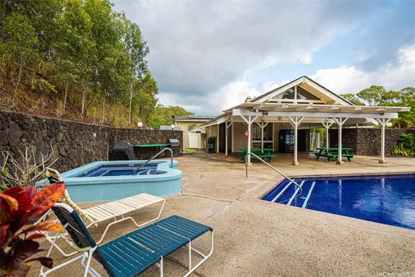 a view of a swimming pool with a patio