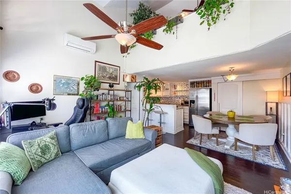 a living room filled with furniture and a clock