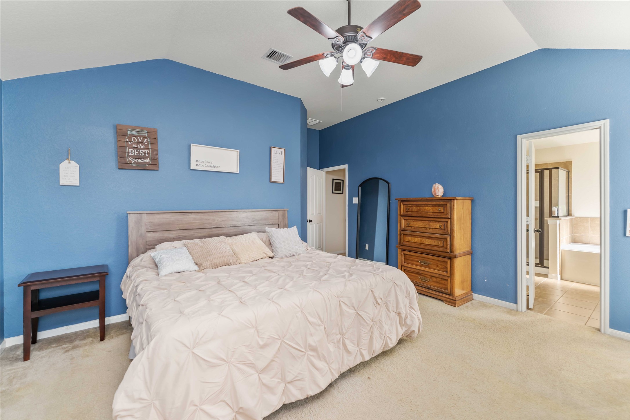 8226 Silent Deep Drive Rosenberg, TX 77469 - Photo 13 of 23 a bedroom with a bed and a chandelier