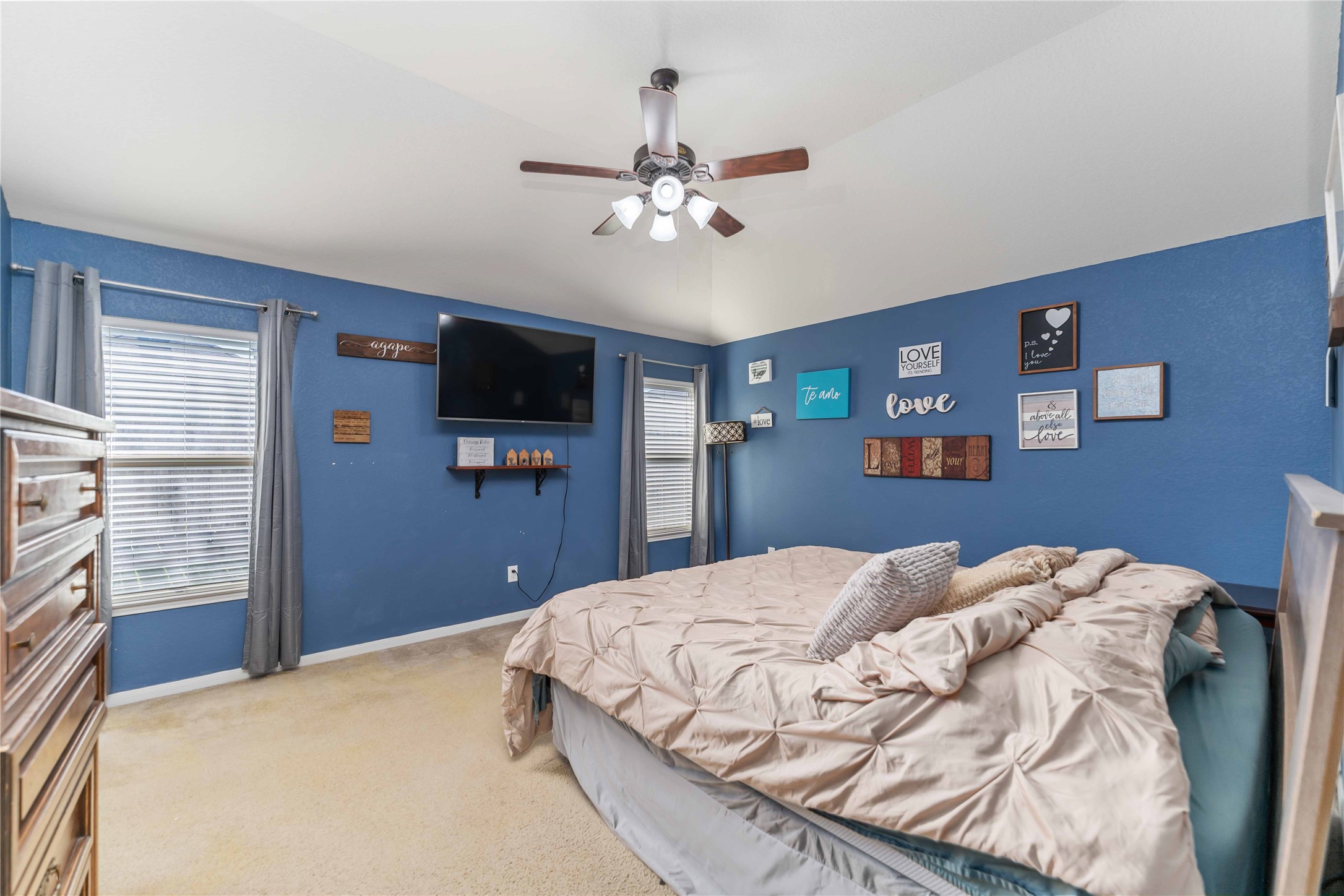 8226 Silent Deep Drive Rosenberg, TX 77469 - Photo 14 of 23 a bedroom with a bed and a flat screen tv