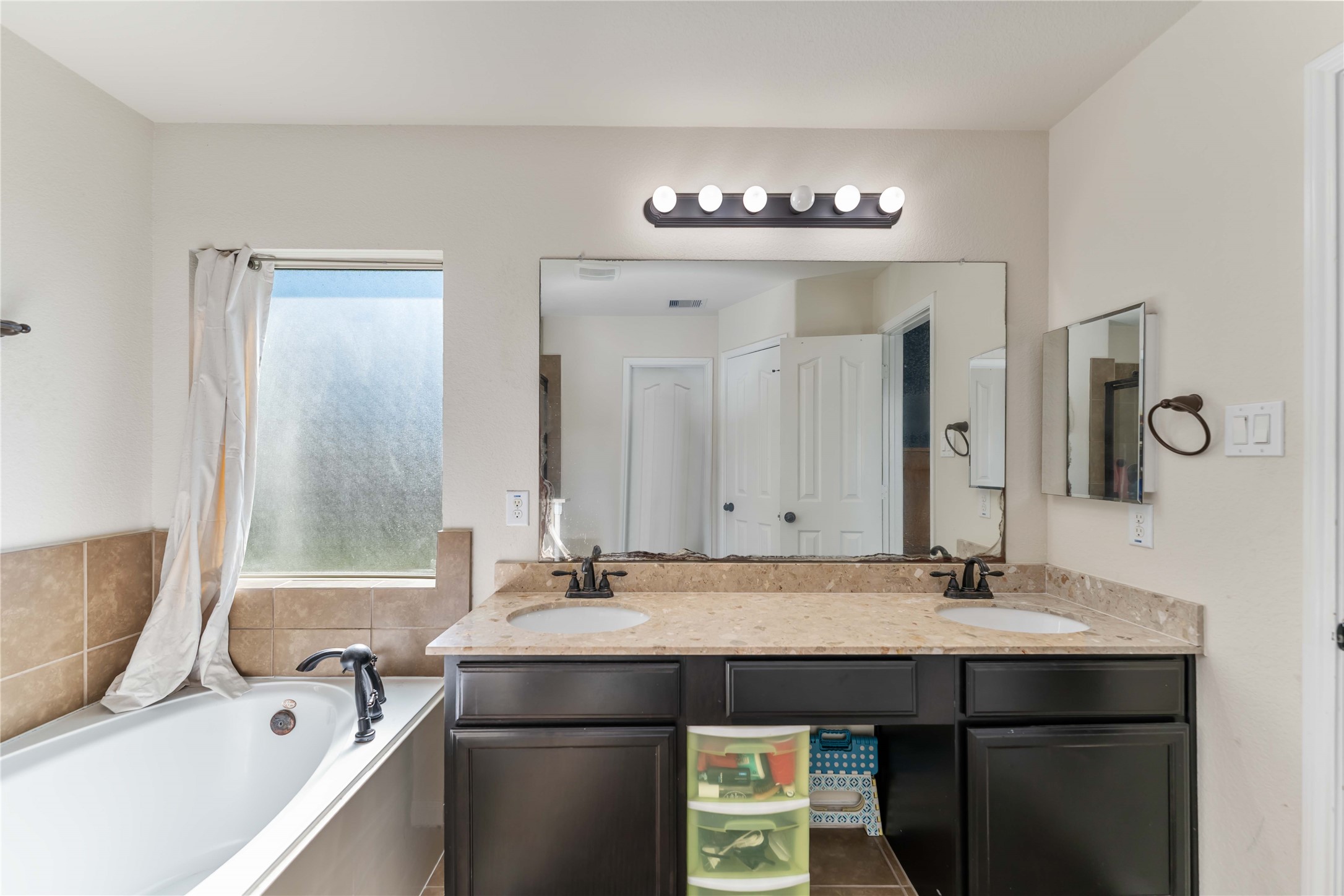 8226 Silent Deep Drive Rosenberg, TX 77469 - Photo 15 of 23 a bathroom with a sink and a mirror