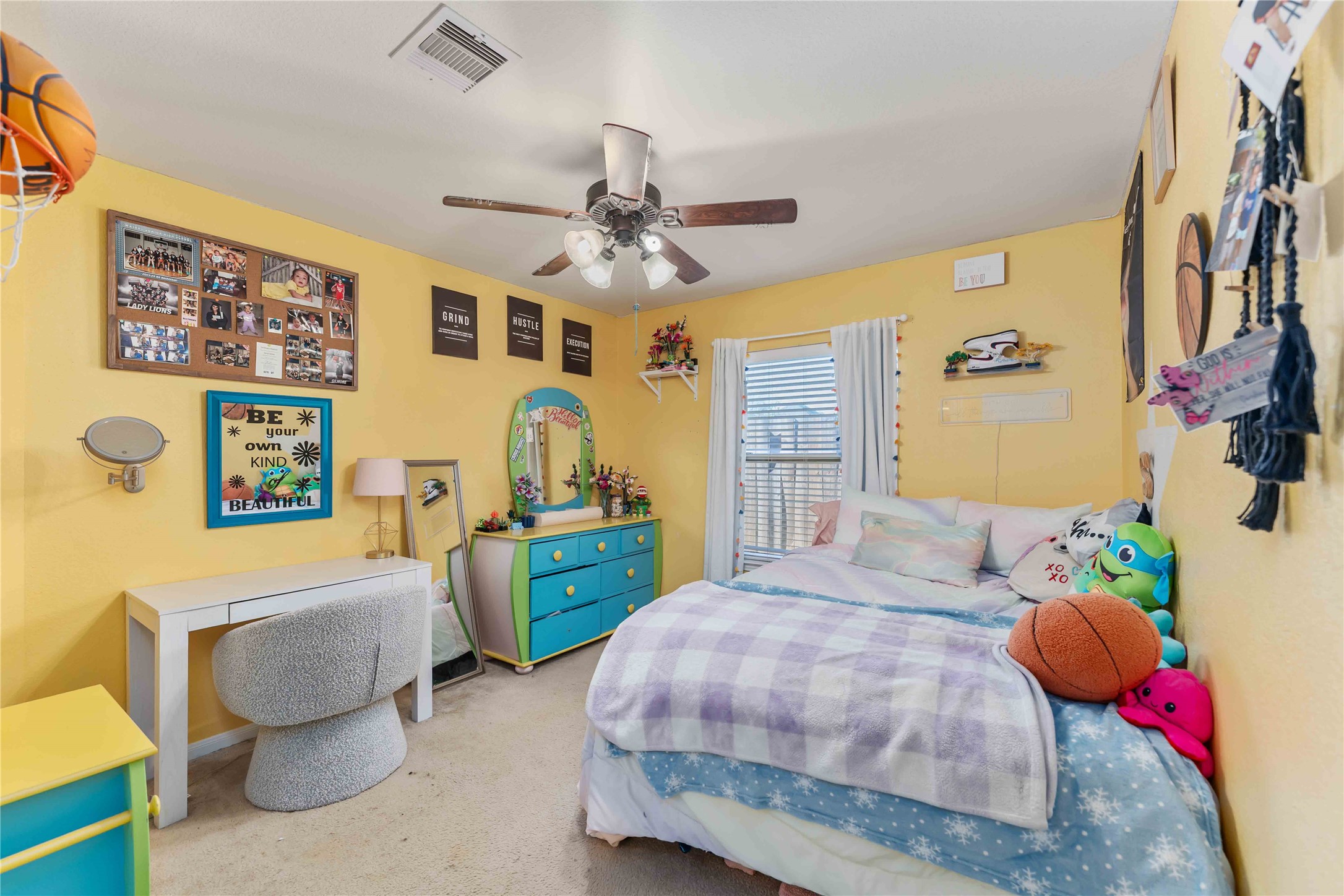 8226 Silent Deep Drive Rosenberg, TX 77469 - Photo 17 of 23 a bedroom with a bed and a chandelier