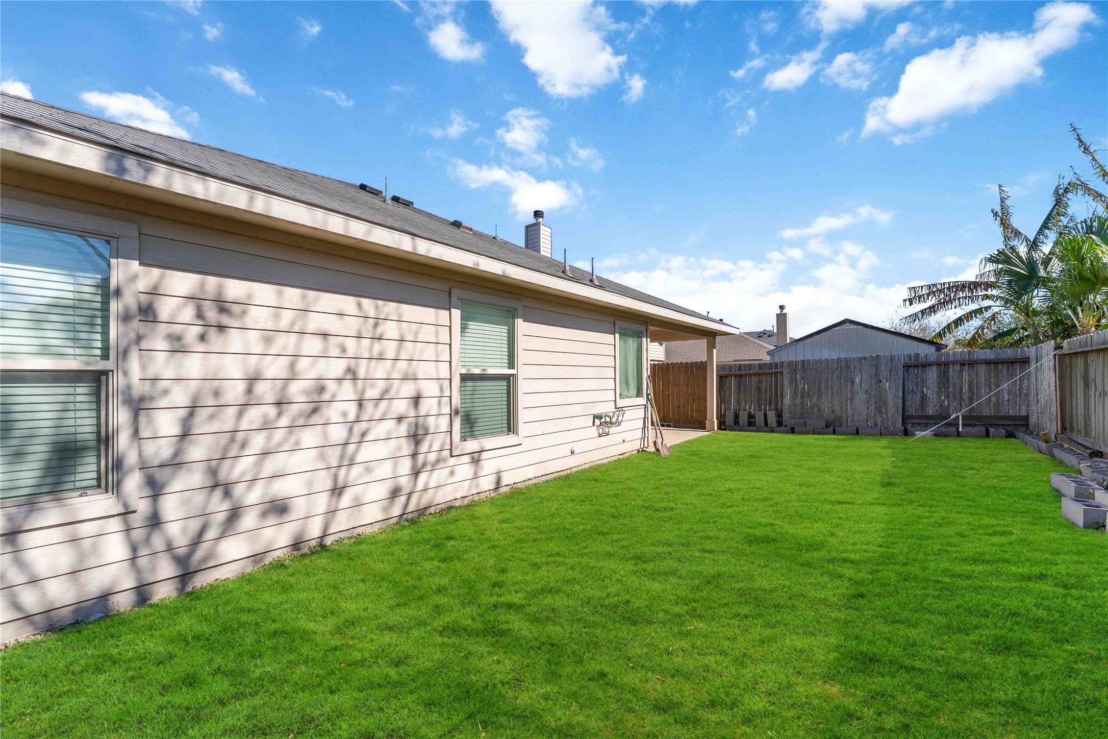 8226 Silent Deep Drive Rosenberg, TX 77469 - Photo 21 of 23 a view of a backyard with wooden fence