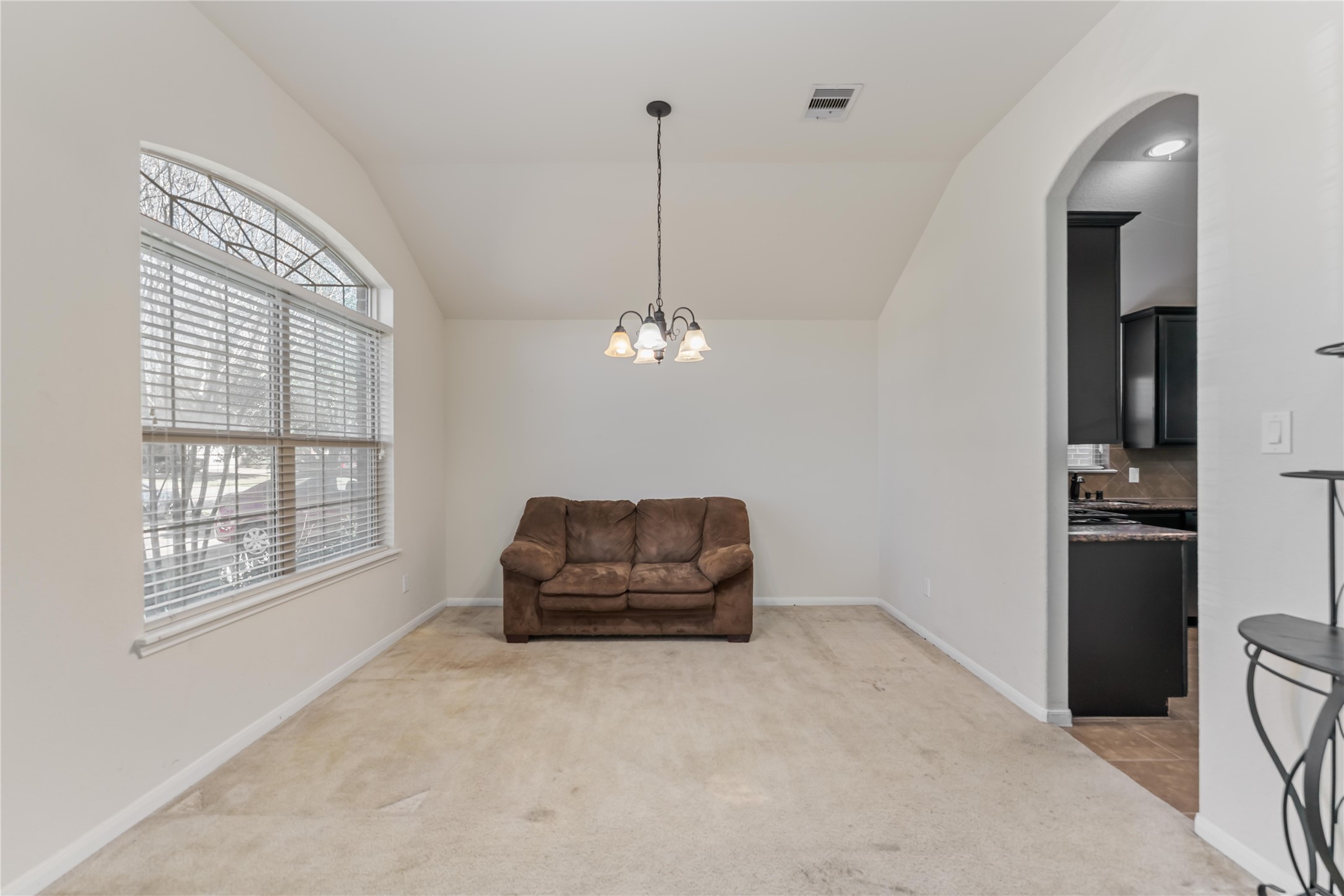8226 Silent Deep Drive Rosenberg, TX 77469 - Photo 3 of 23 a living room with furniture a ceiling fan and a window