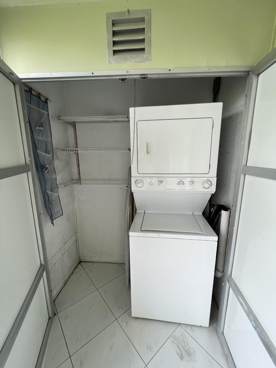 20 Saxony A, Unit A Delray Beach, FL 33446 - Photo 20 of 50 a utility room with dryer and washer