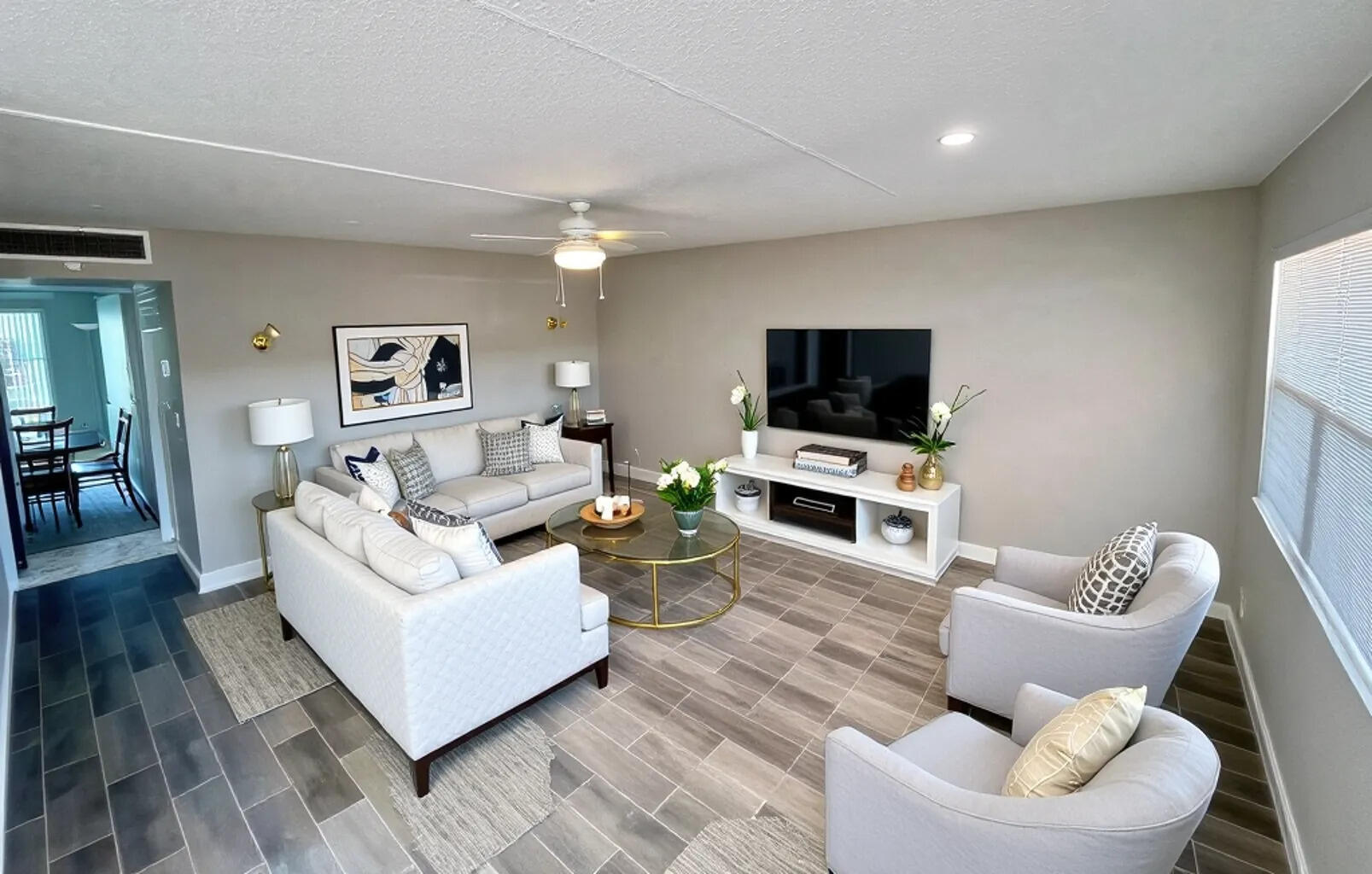 20 Saxony A, Unit A Delray Beach, FL 33446 - Photo 8 of 50 a living room with furniture and a flat screen tv