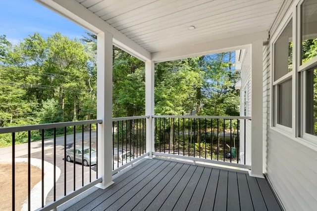 a view of a room with wooden floor and wooden floor